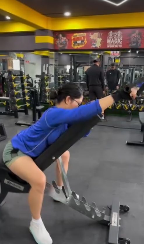 Body Workshop member training on a resistance machine at the Kathmandu gym